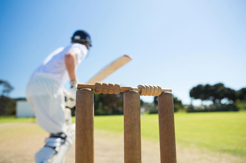 Cricket stumps on a cricket field